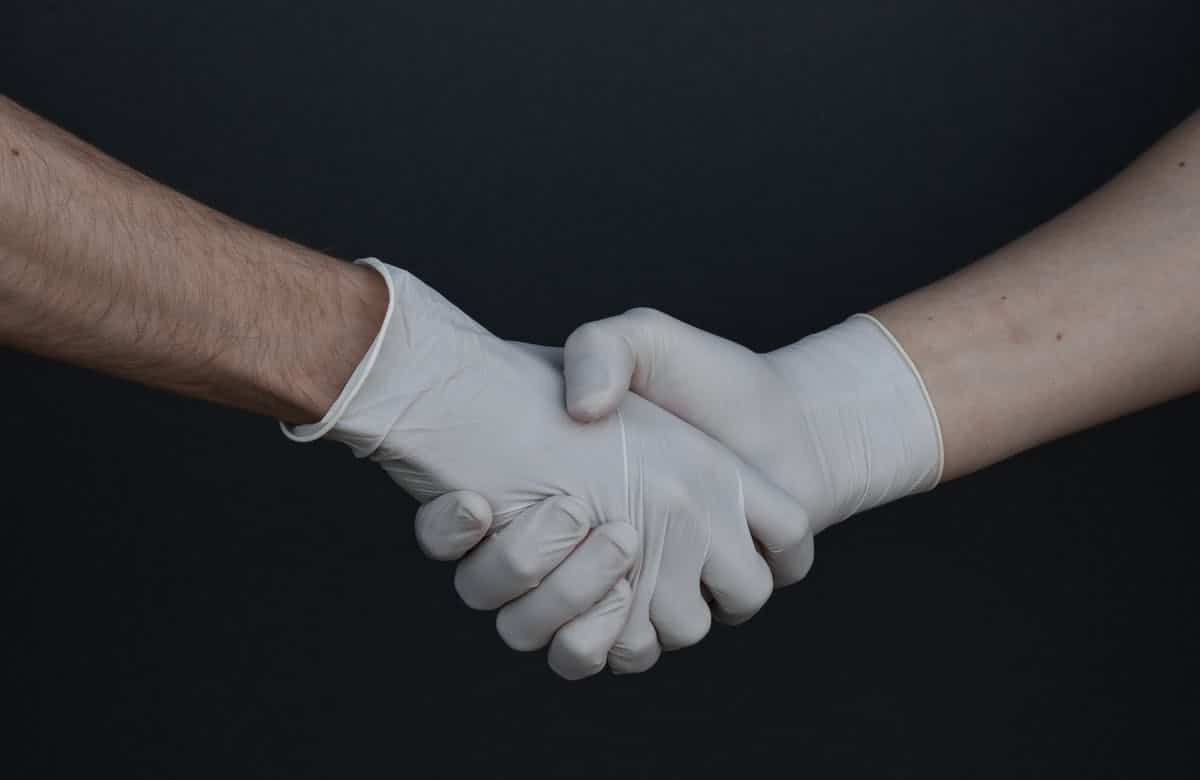Shaking gloved hands