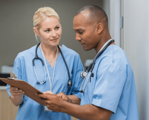 Healthcare team consulting a patient's chart
