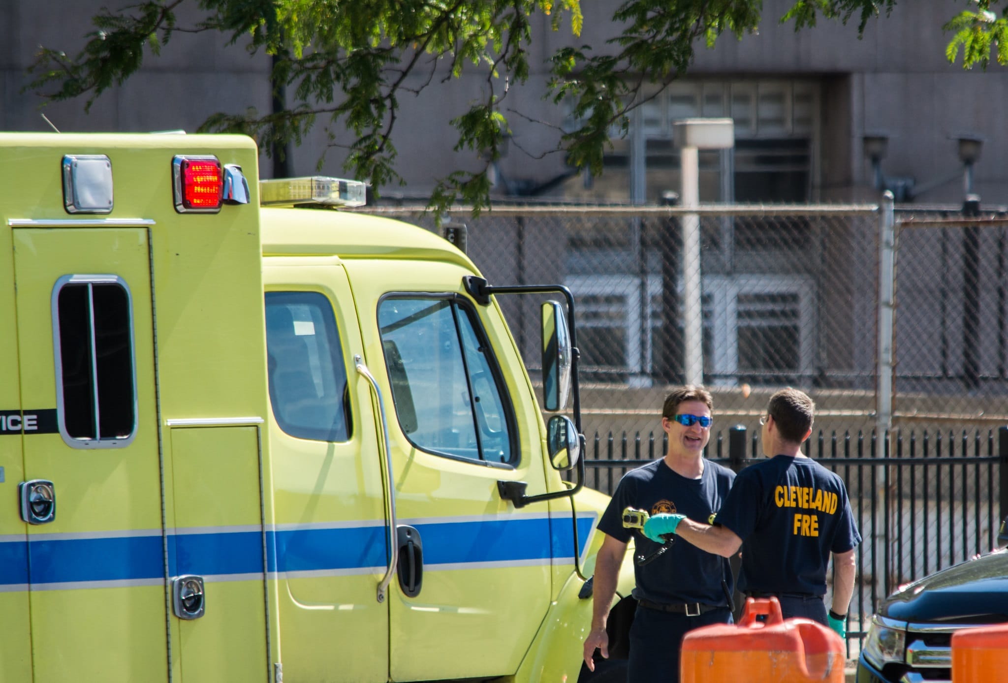 Two EMS workers by an ambulance