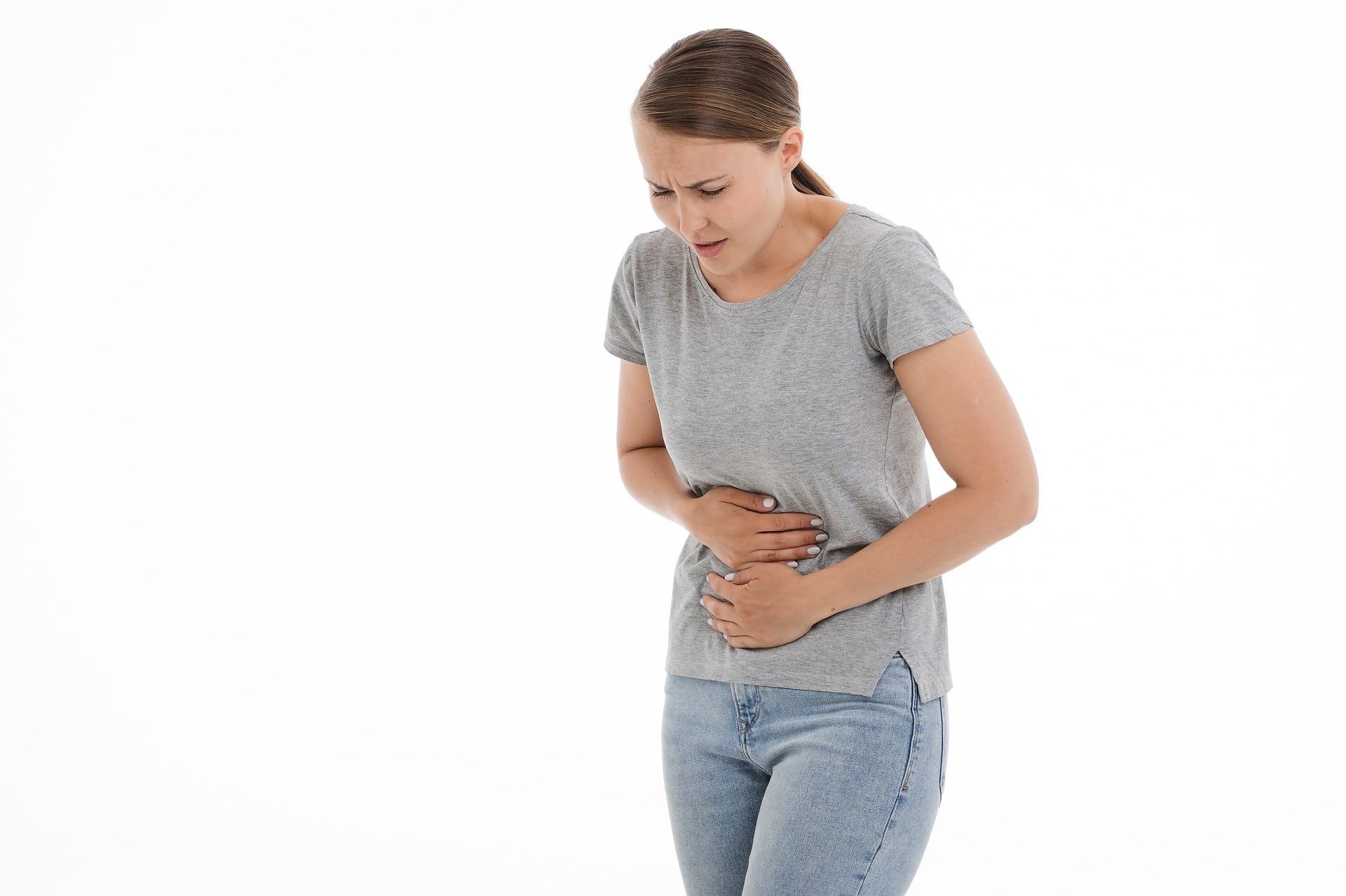 Woman clutching her stomach in pain
