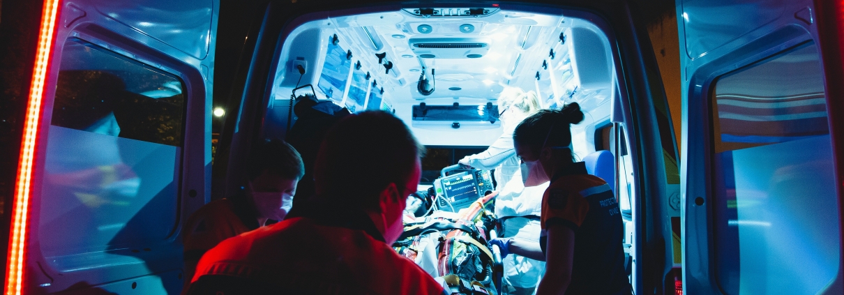 EMS team loading a patient into an ambulance