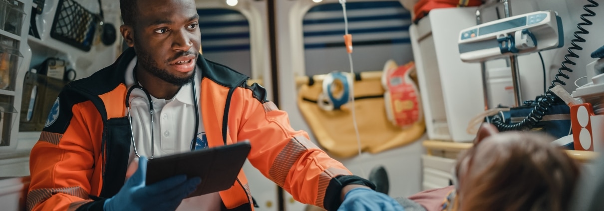 African-American paramedic with a patient