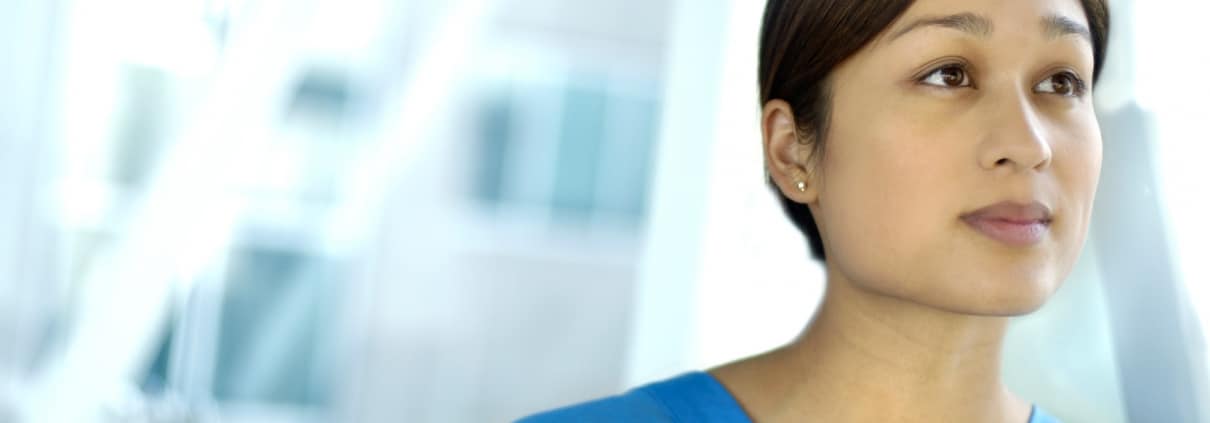 Female healthcare worker looking away