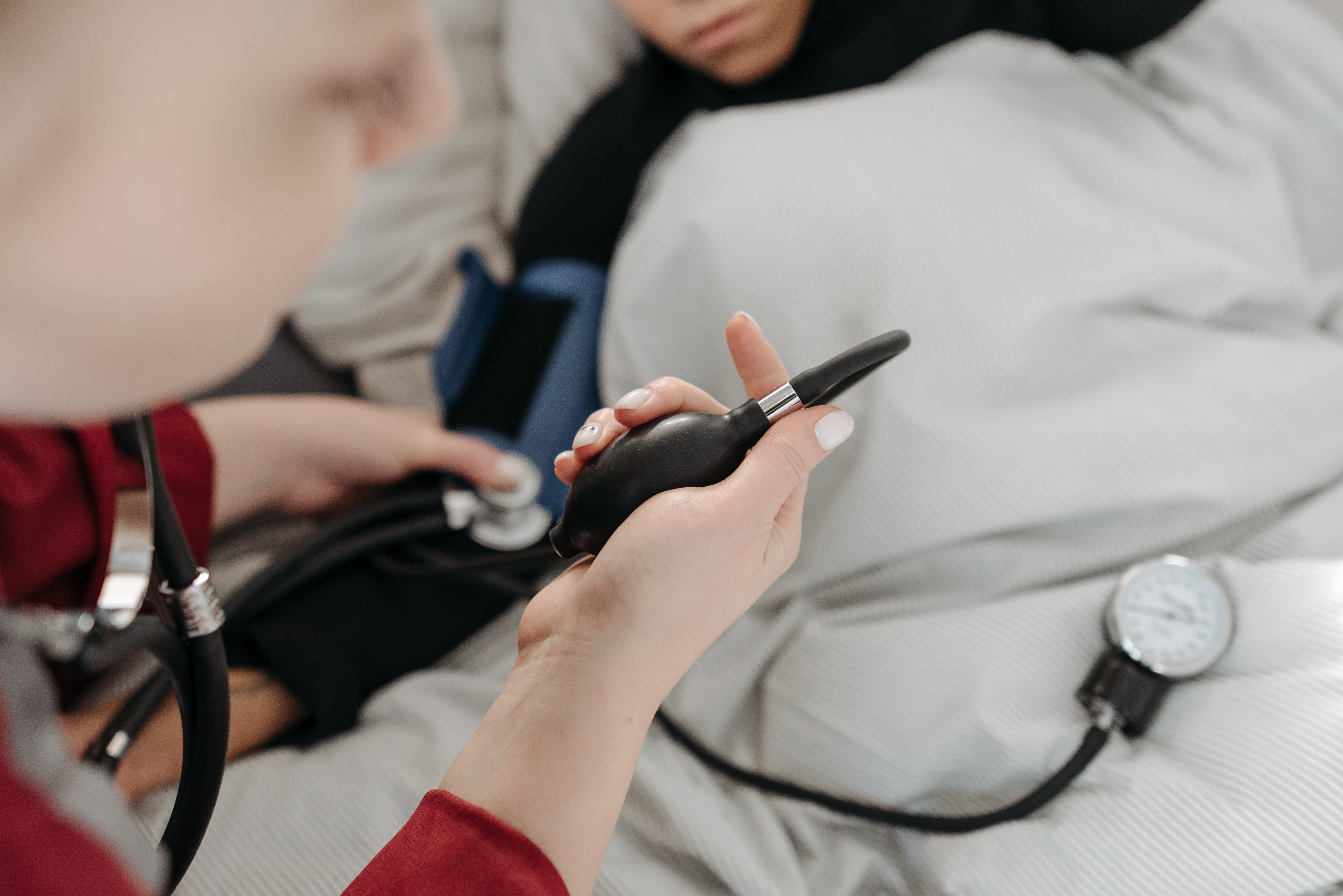 Paramedic taking a woman's vital signs