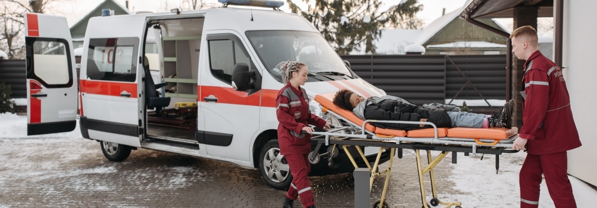 Paramedics transporting a patient in the snow