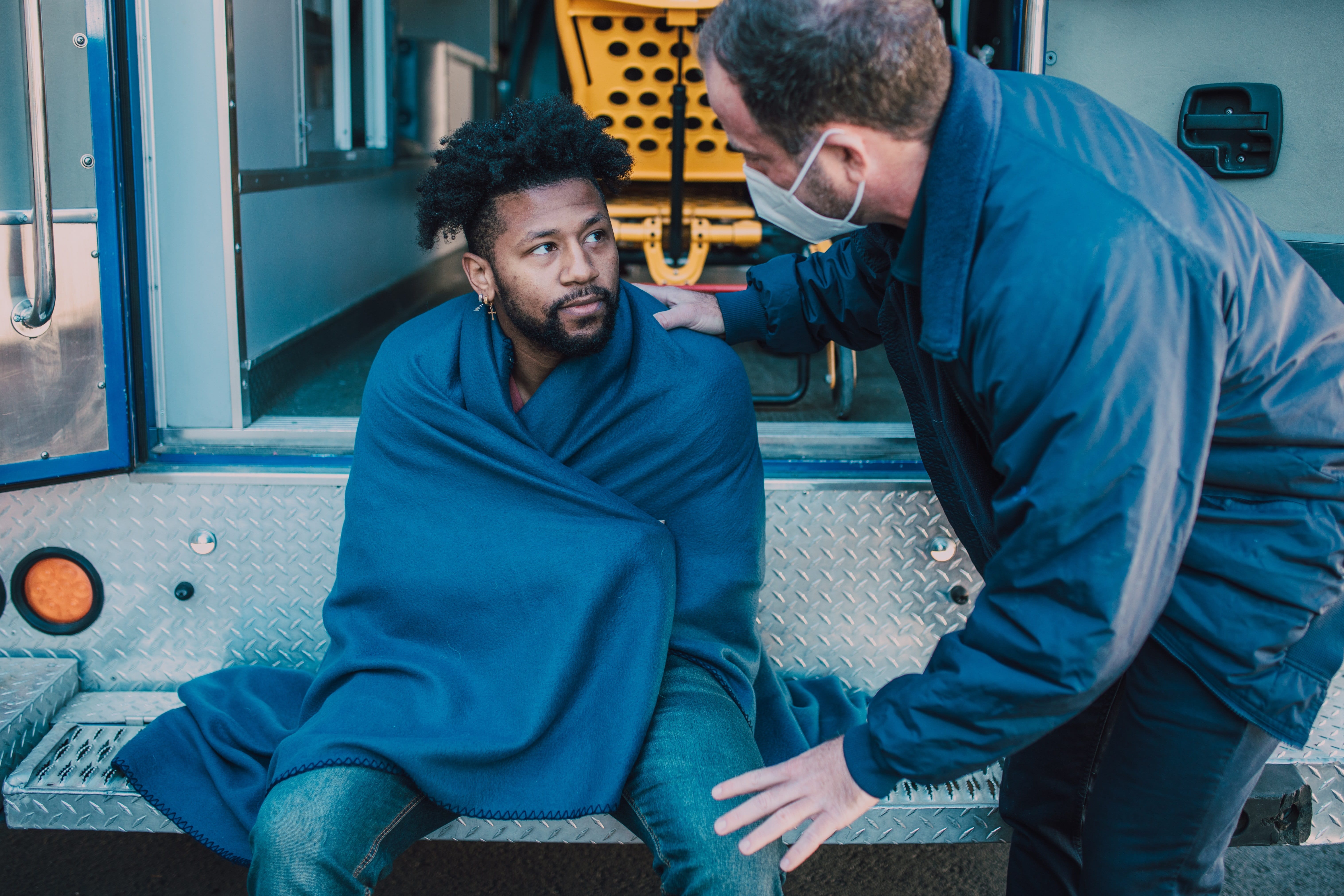Male paramedic assisting a patient