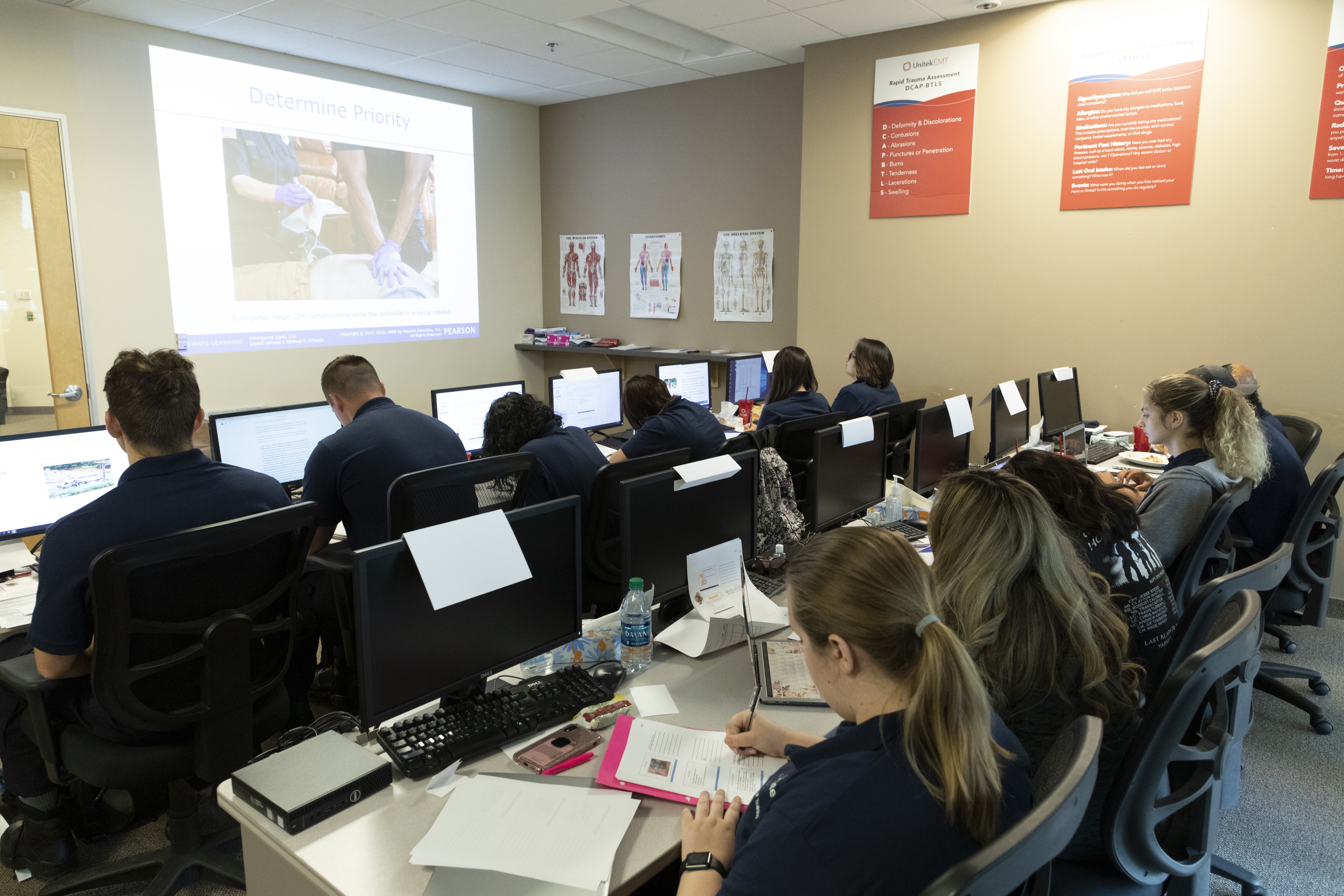 EMT students on computers
