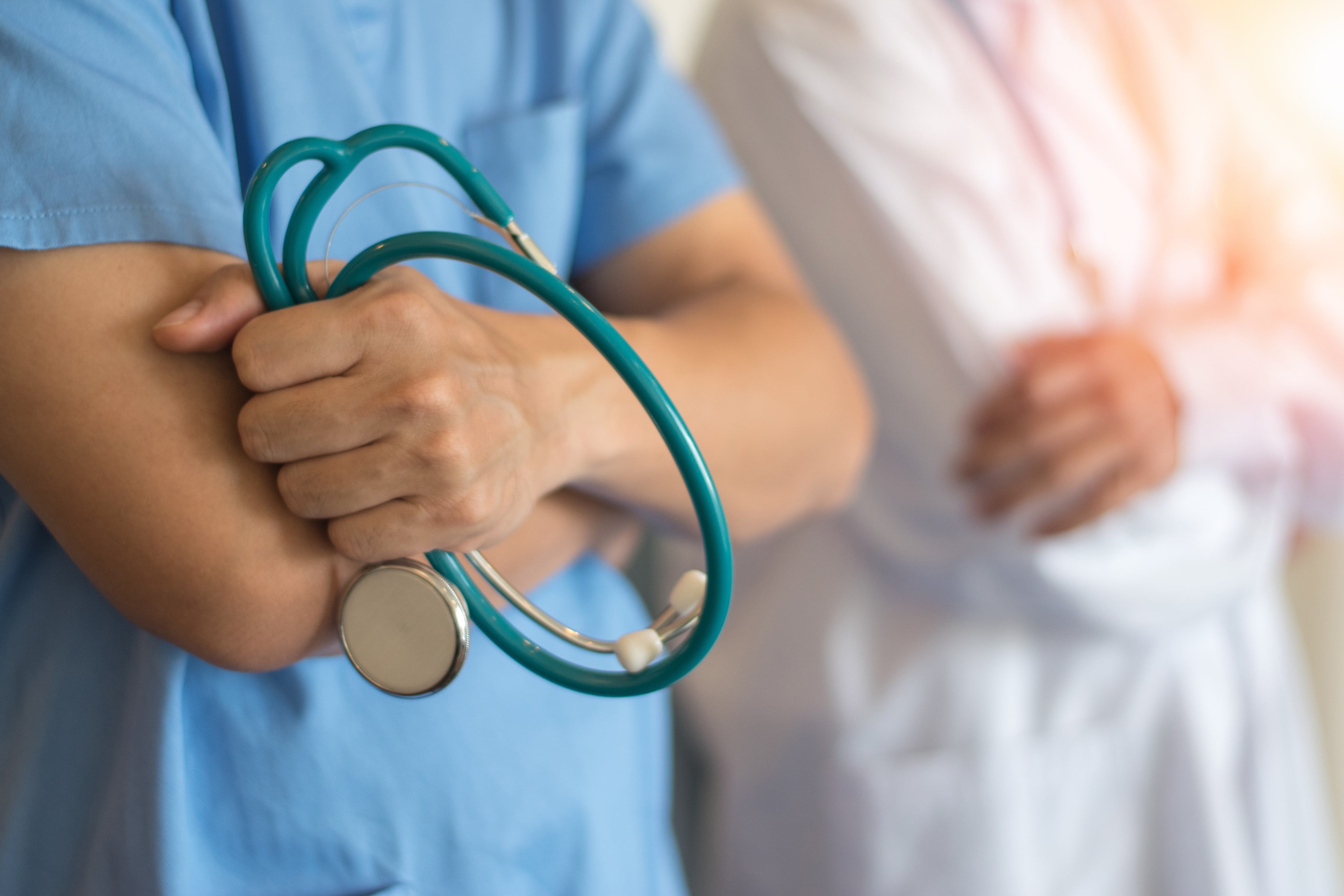 Healthcare professional holding a stethoscope