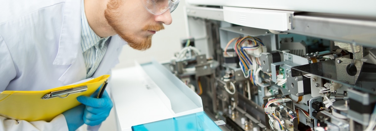 Male professional examining medical equipment