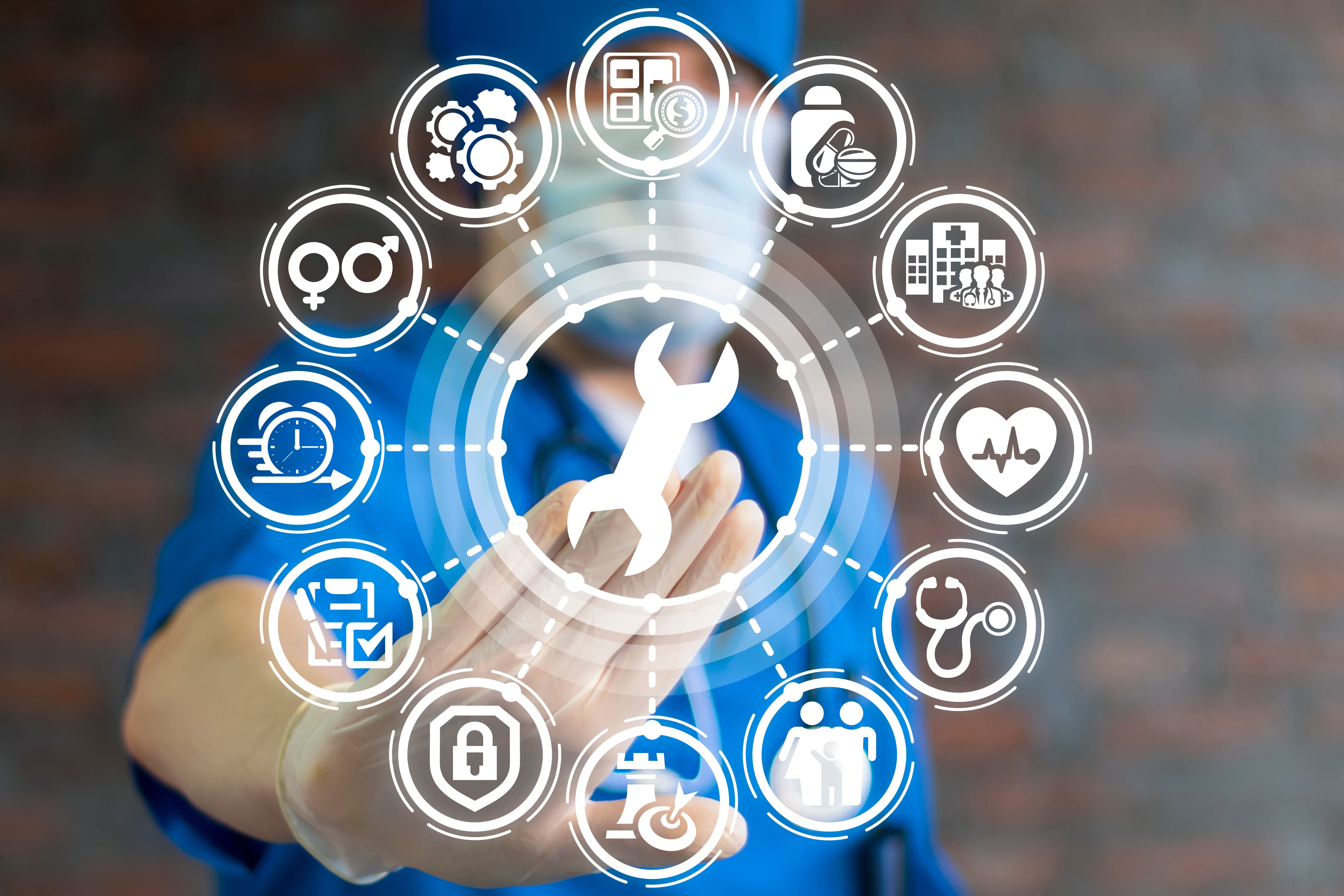 Medical professional touching virtual symbols