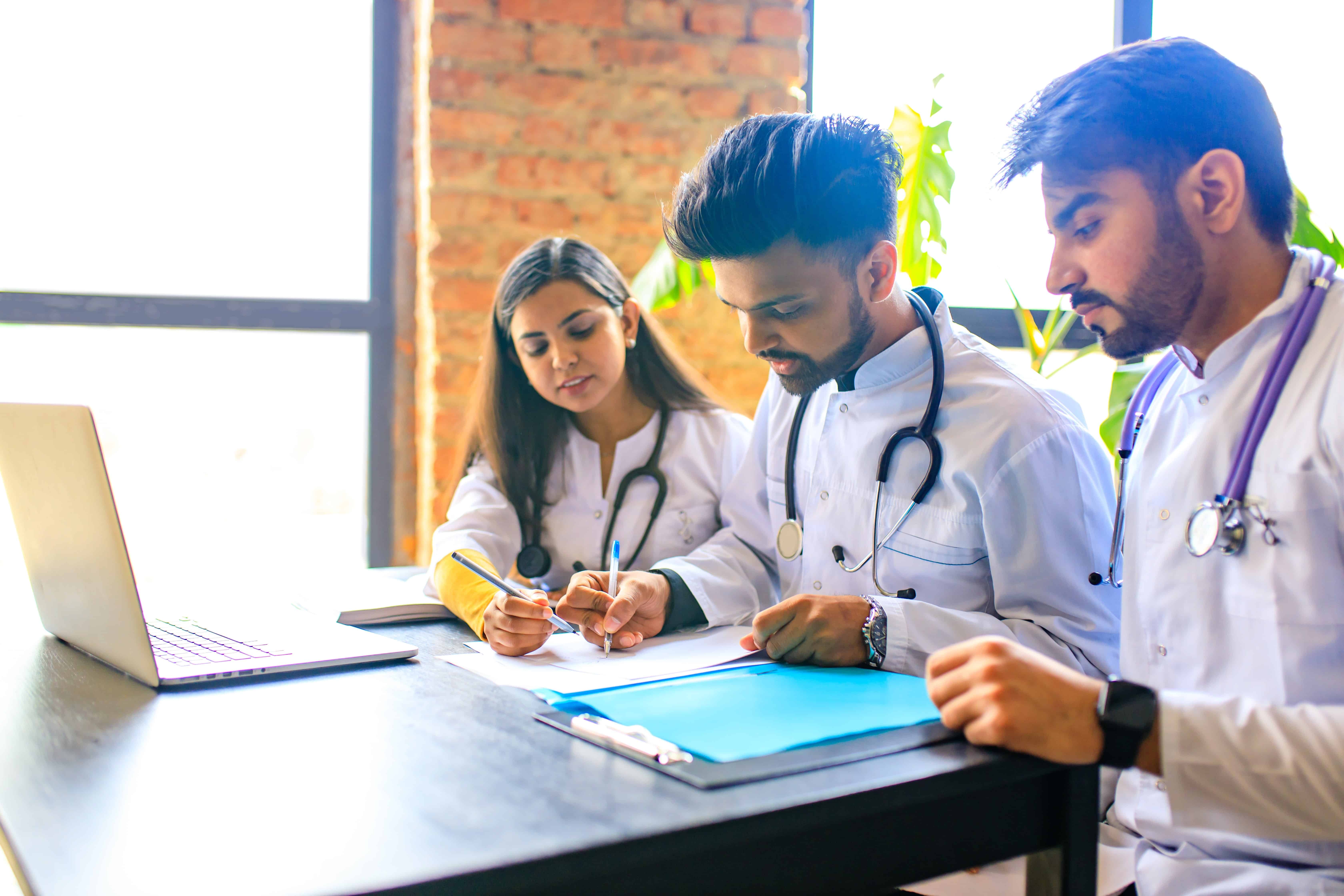 Indian medical students practicing in a classroom