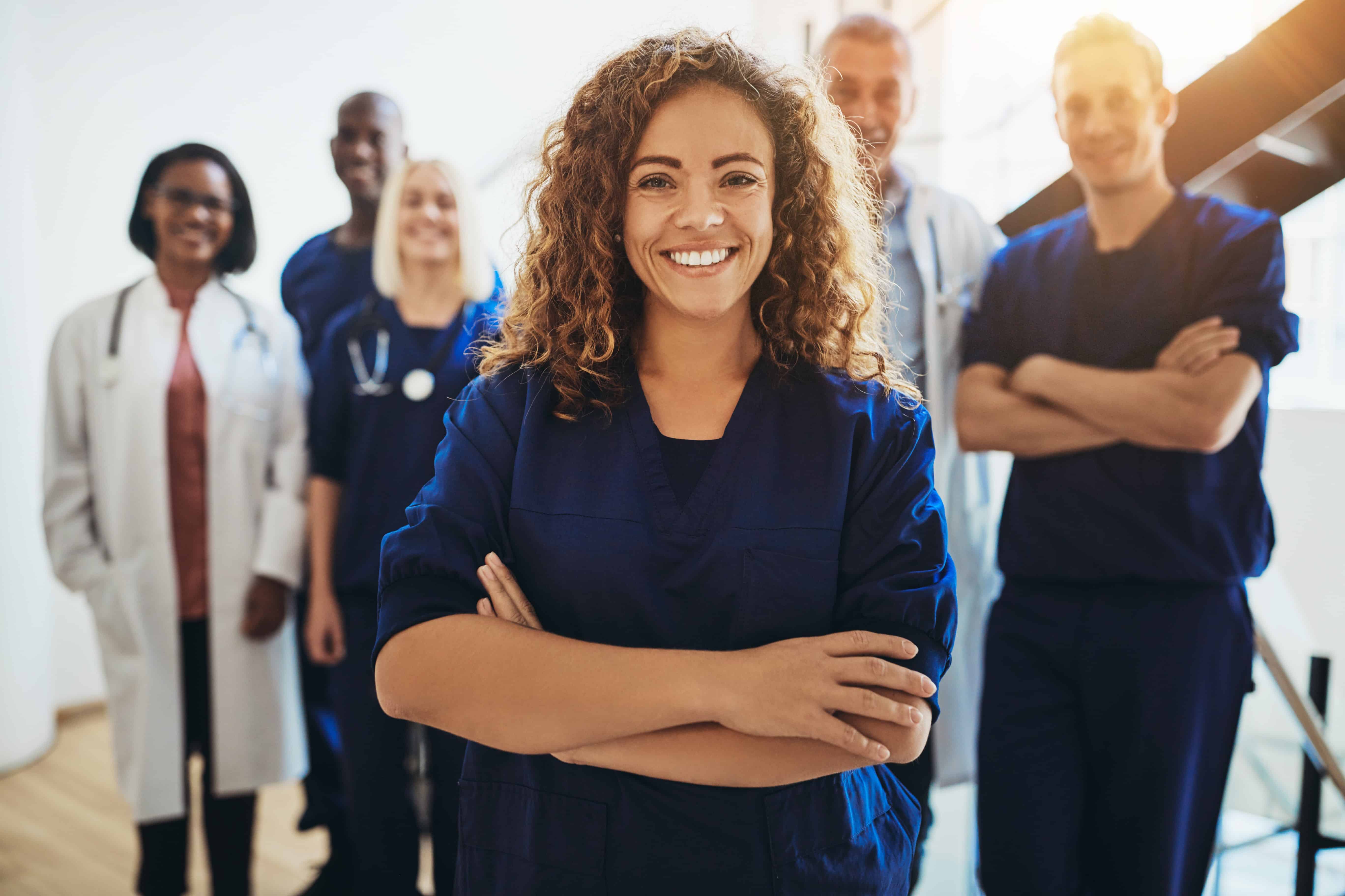 Smiling medical team in a stairwell