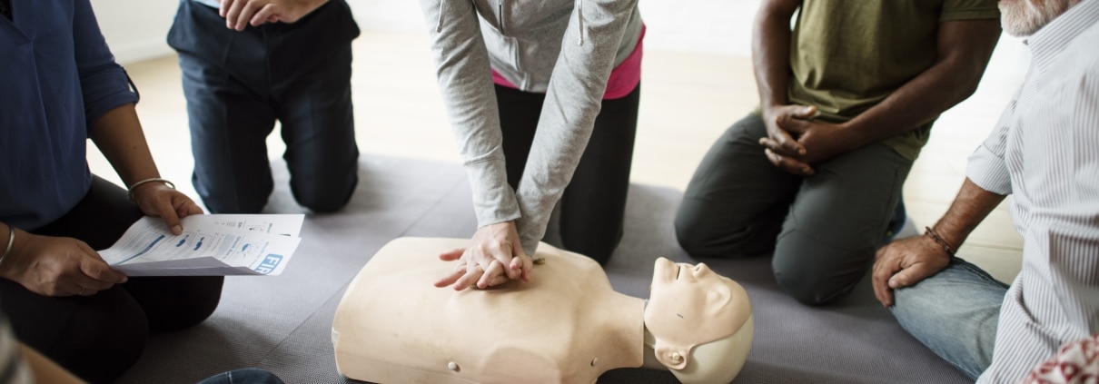 CPR training class with a mannequin