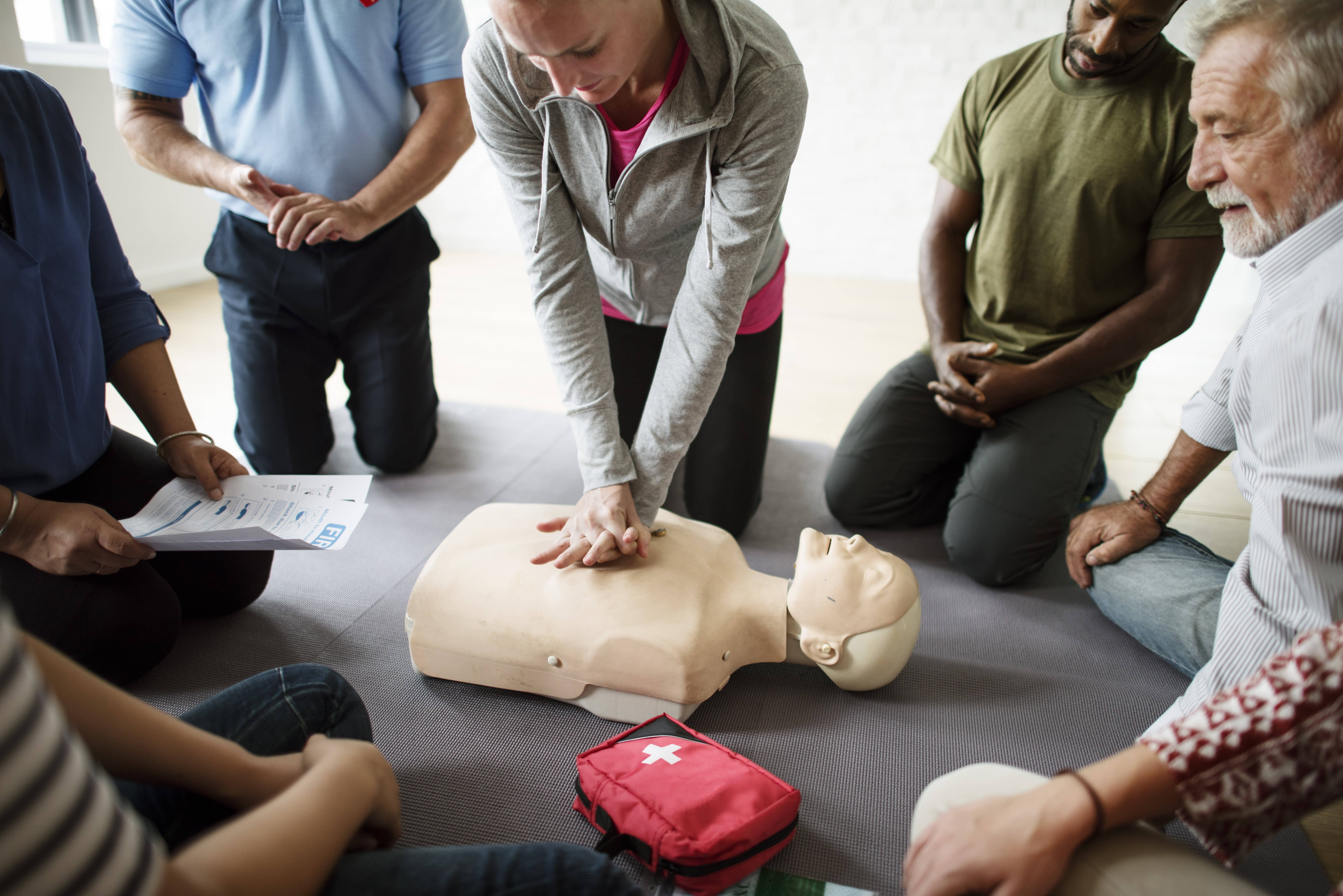 CPR training class with a mannequin