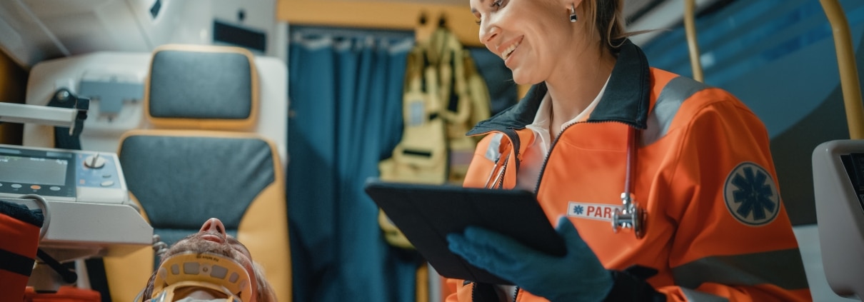 Female EMS professional using a tablet