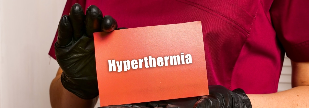 Medical worker holding a sign that says hyperthermia