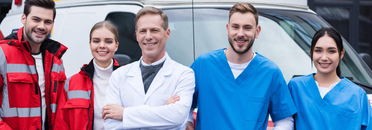 Happy EMS workers with doctors and nurses