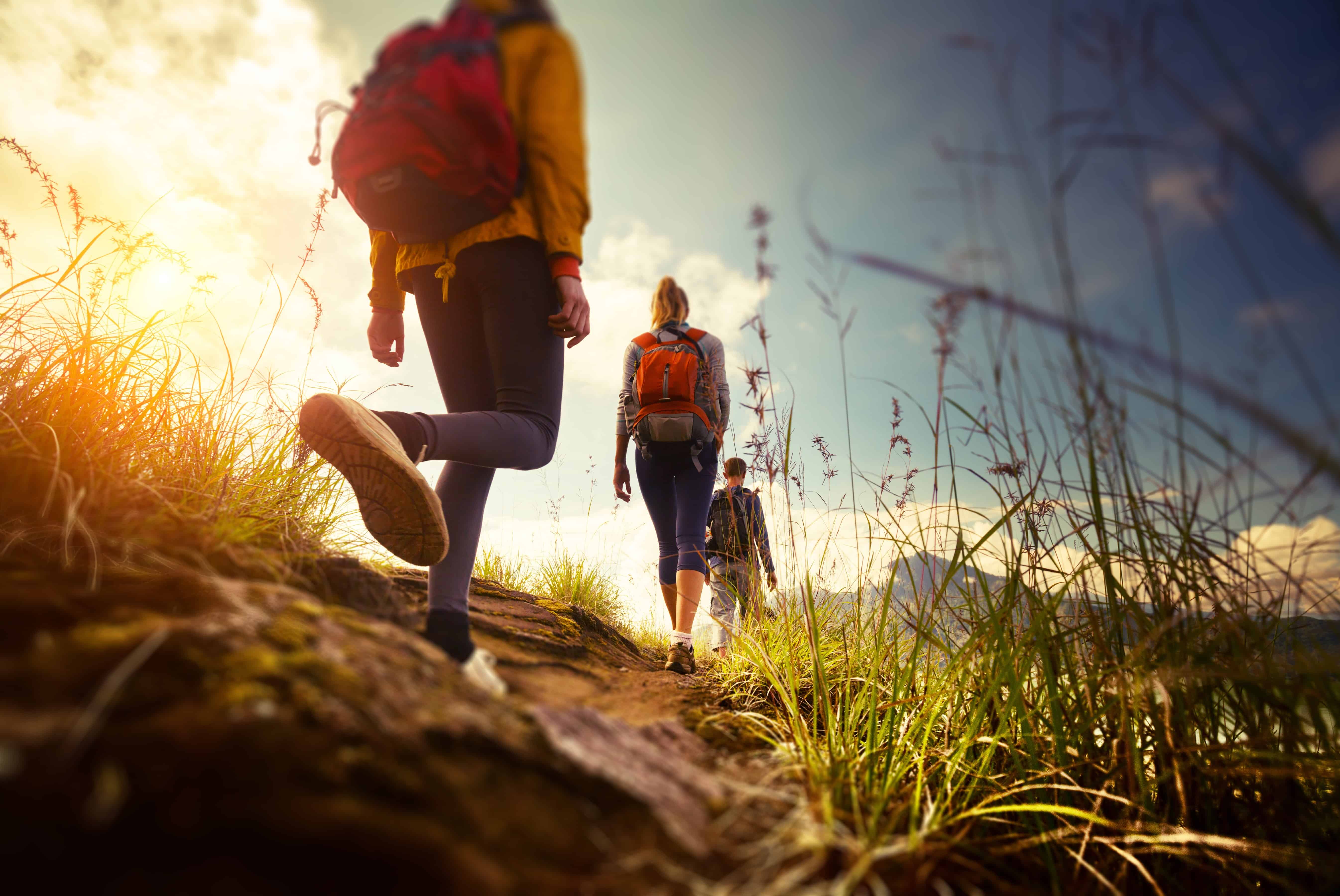 Close up of people hiking on a trail