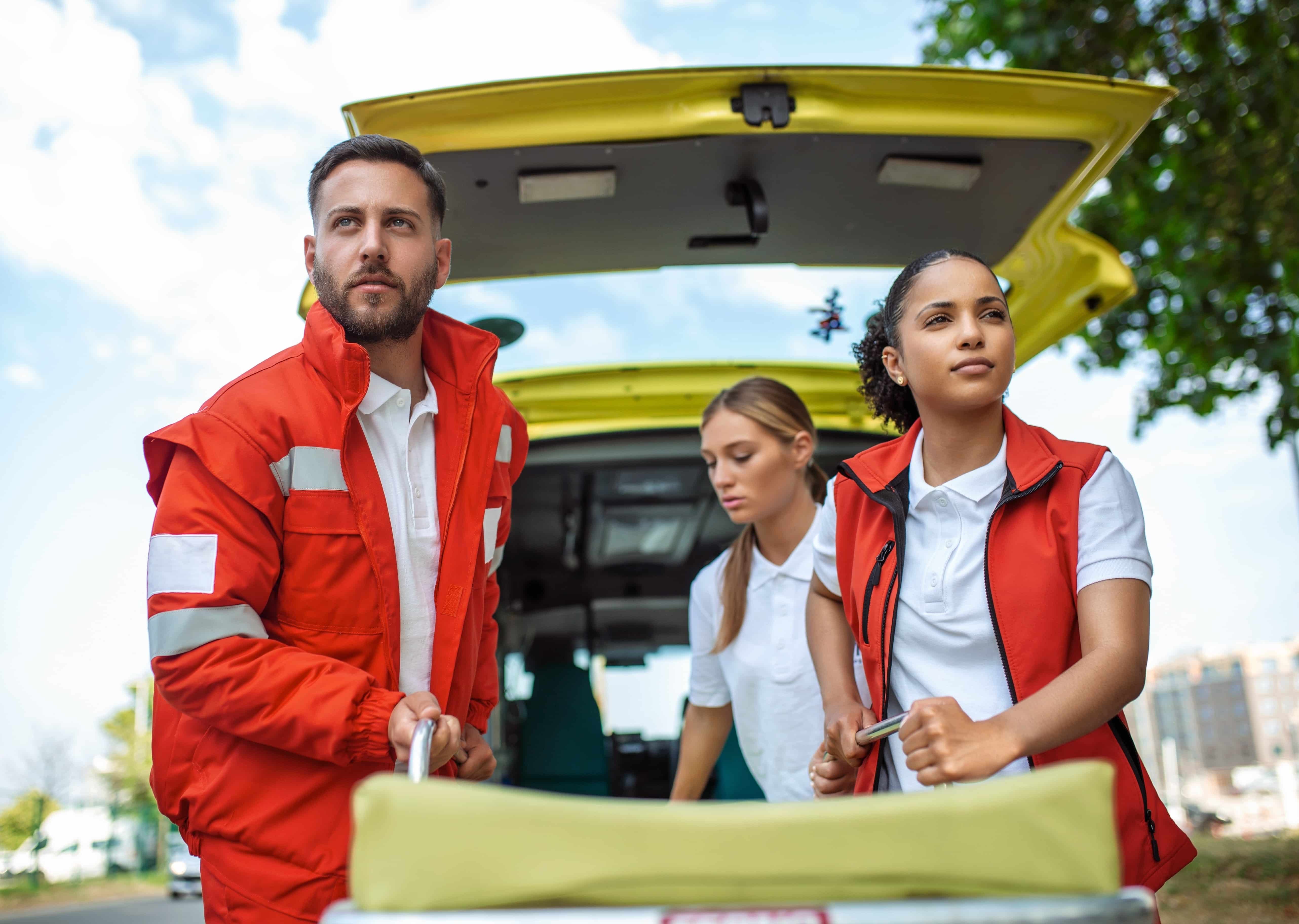 EMS team standing by their ambulance