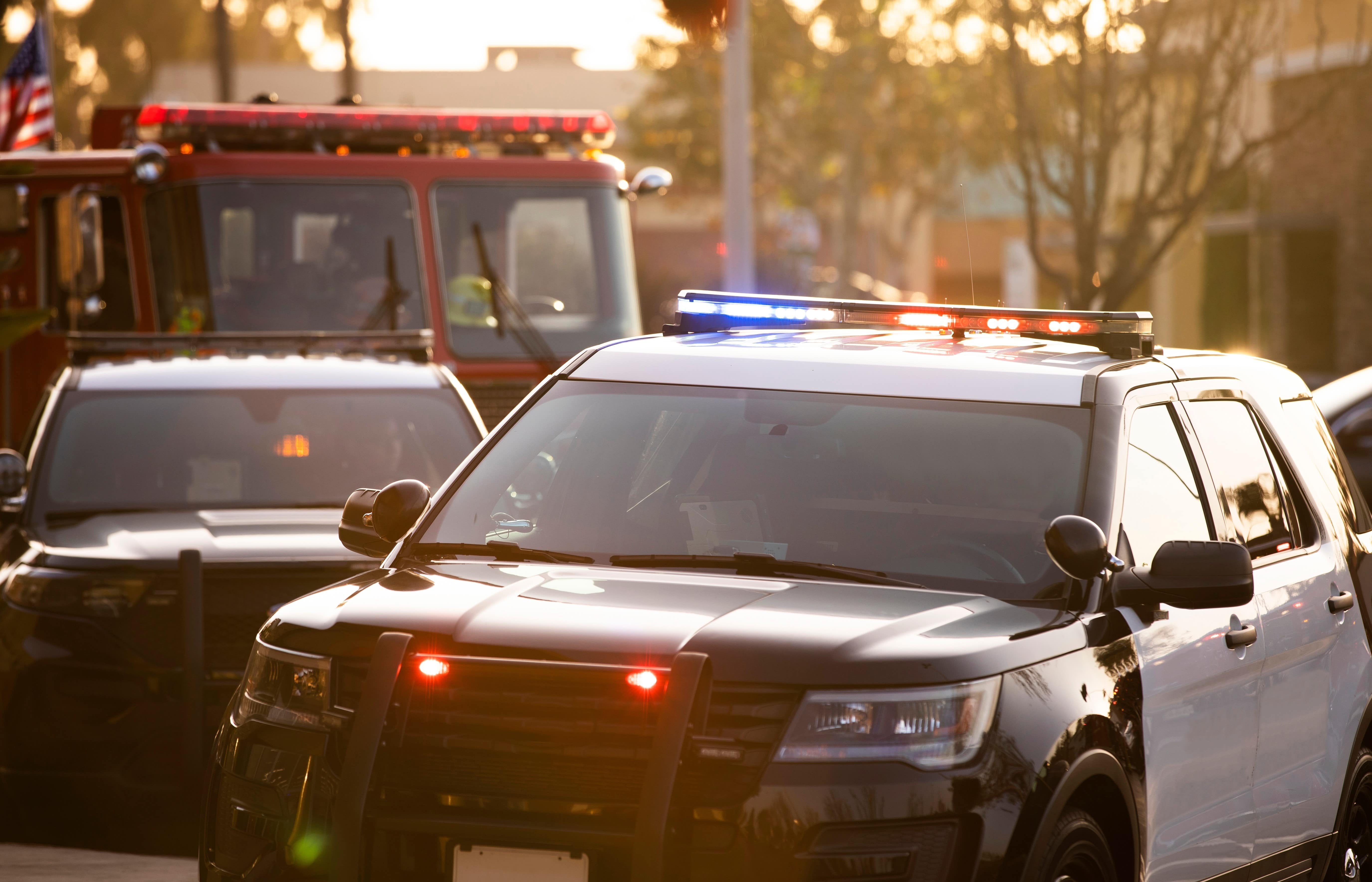 Close up of police cars and a fire engine truck