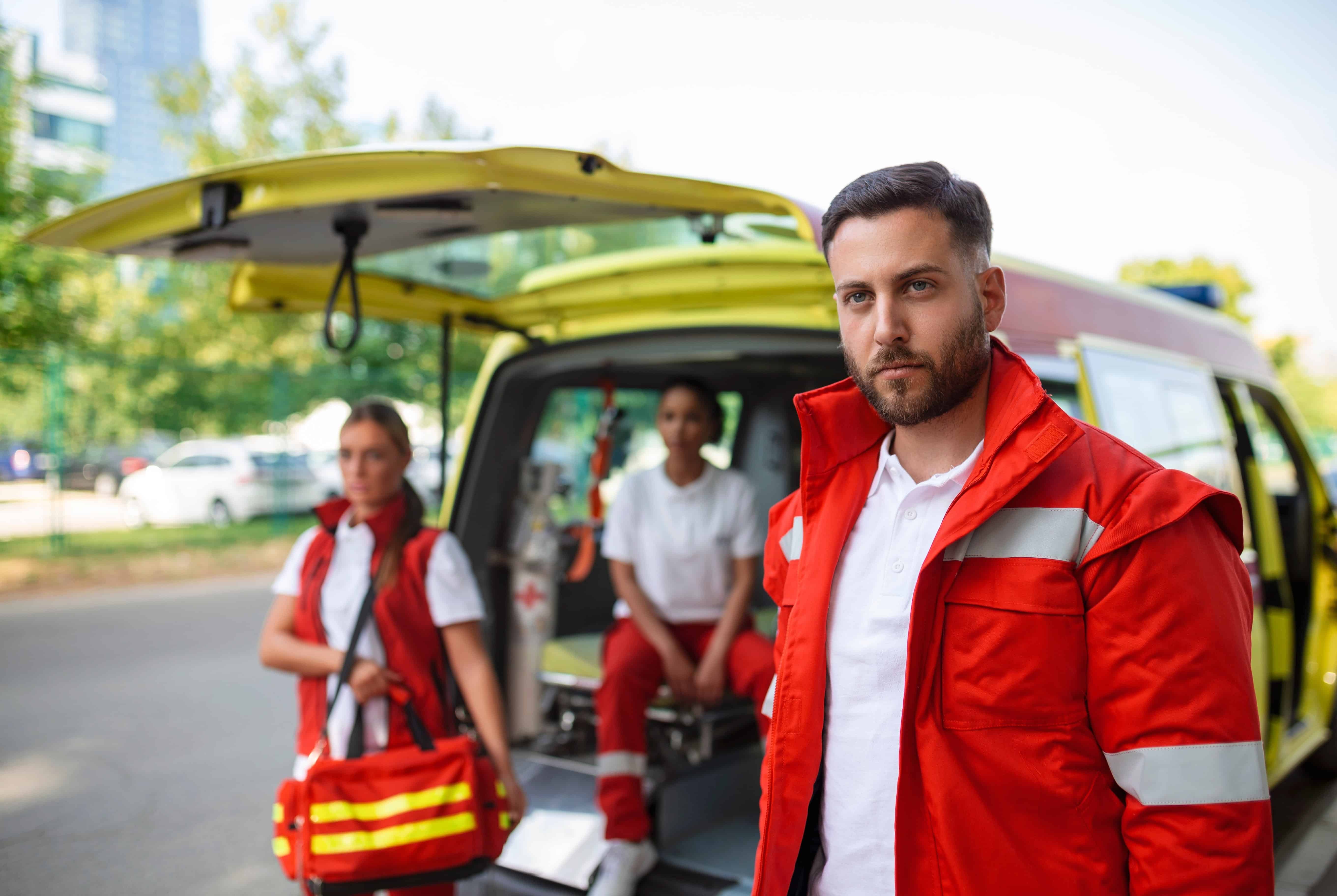 Close up of EMS professionals beside an ambulance
