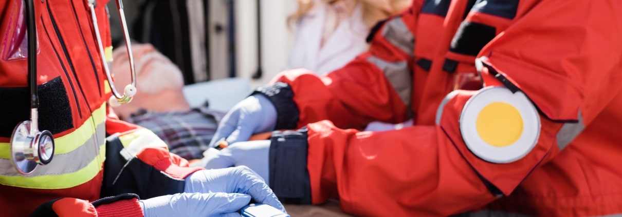 Close up of an EMS team transporting an older man