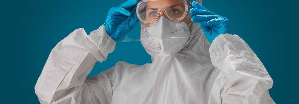 Person in a hazmat suit or protective gear