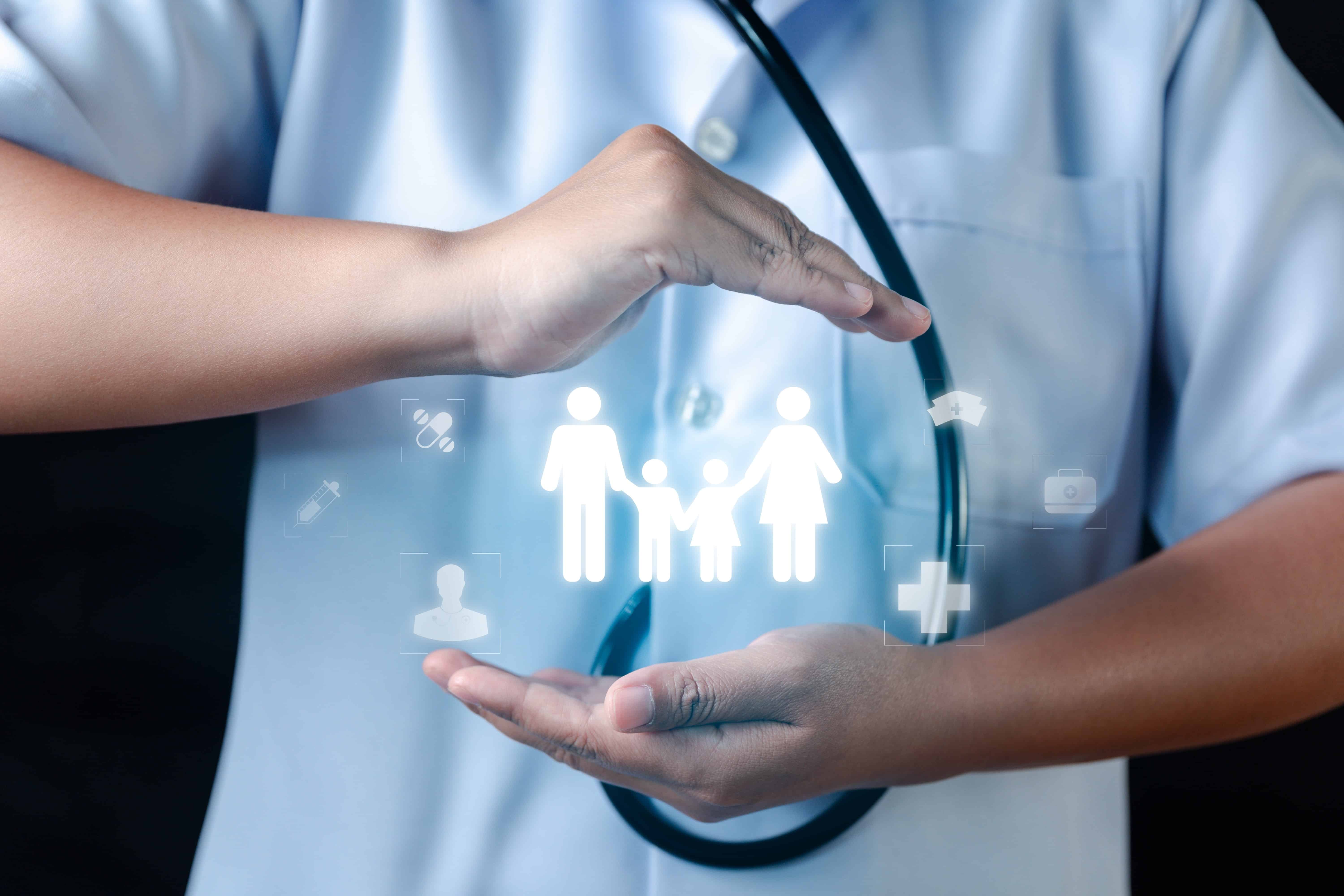 Medial professional placing their hands around virtual healthcare symbols