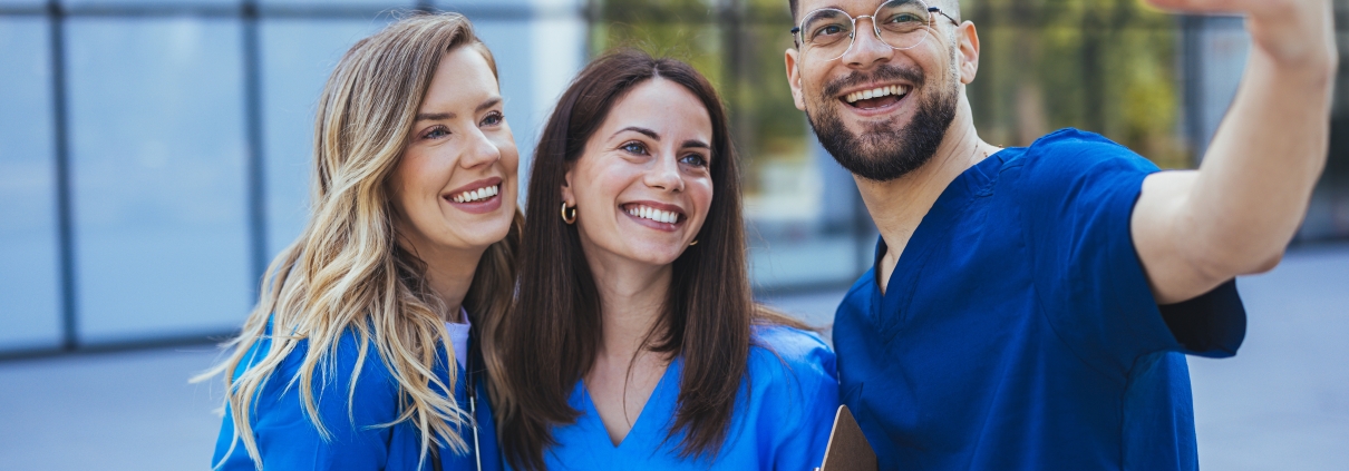Group of nurses taking a selfie outside the hospital