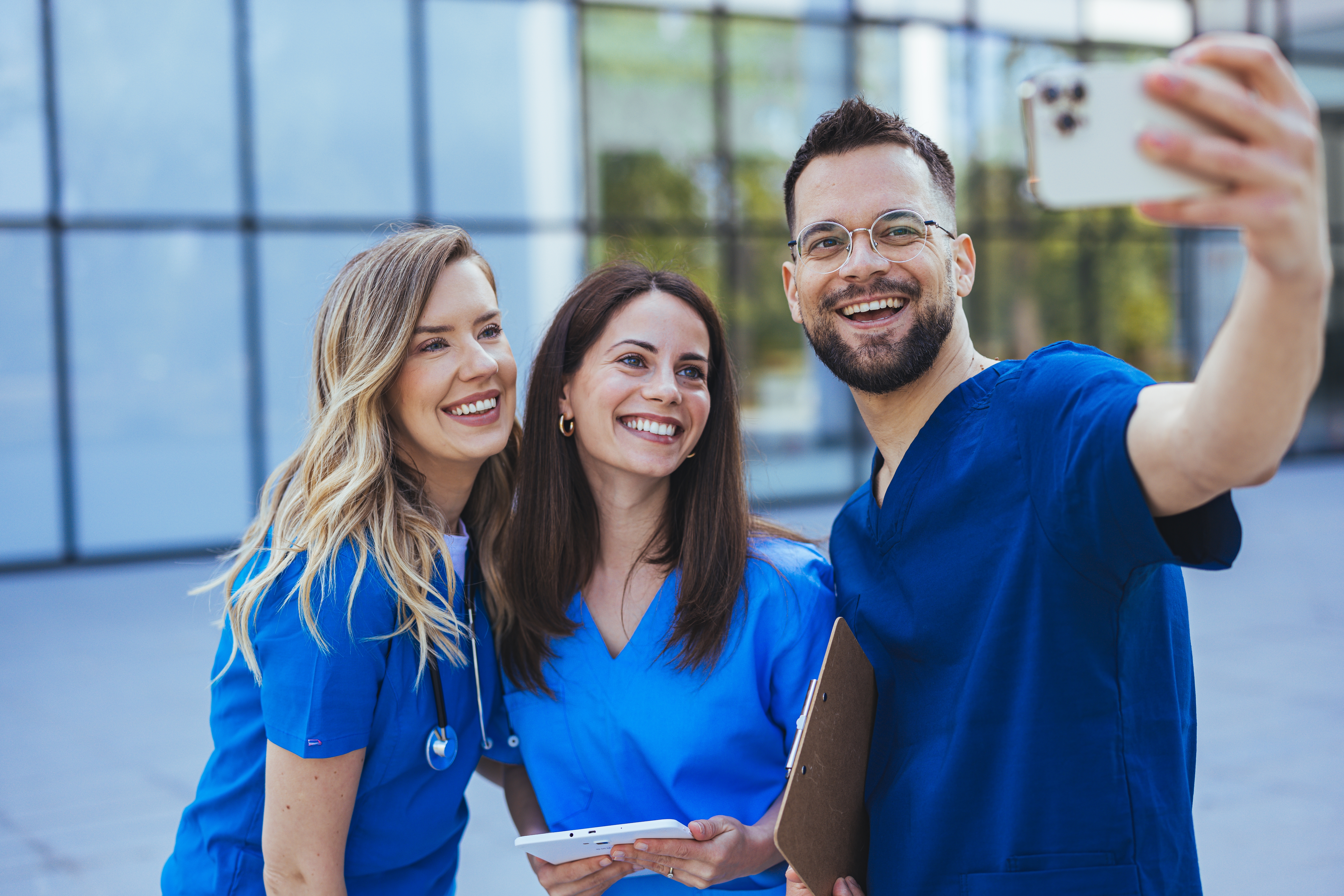 Group of nurses taking a selfie outside the hospital