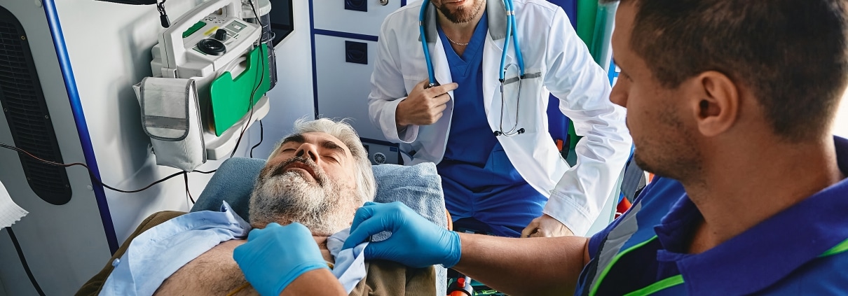 Cardiac emergency in an ambulance with EMS professionals