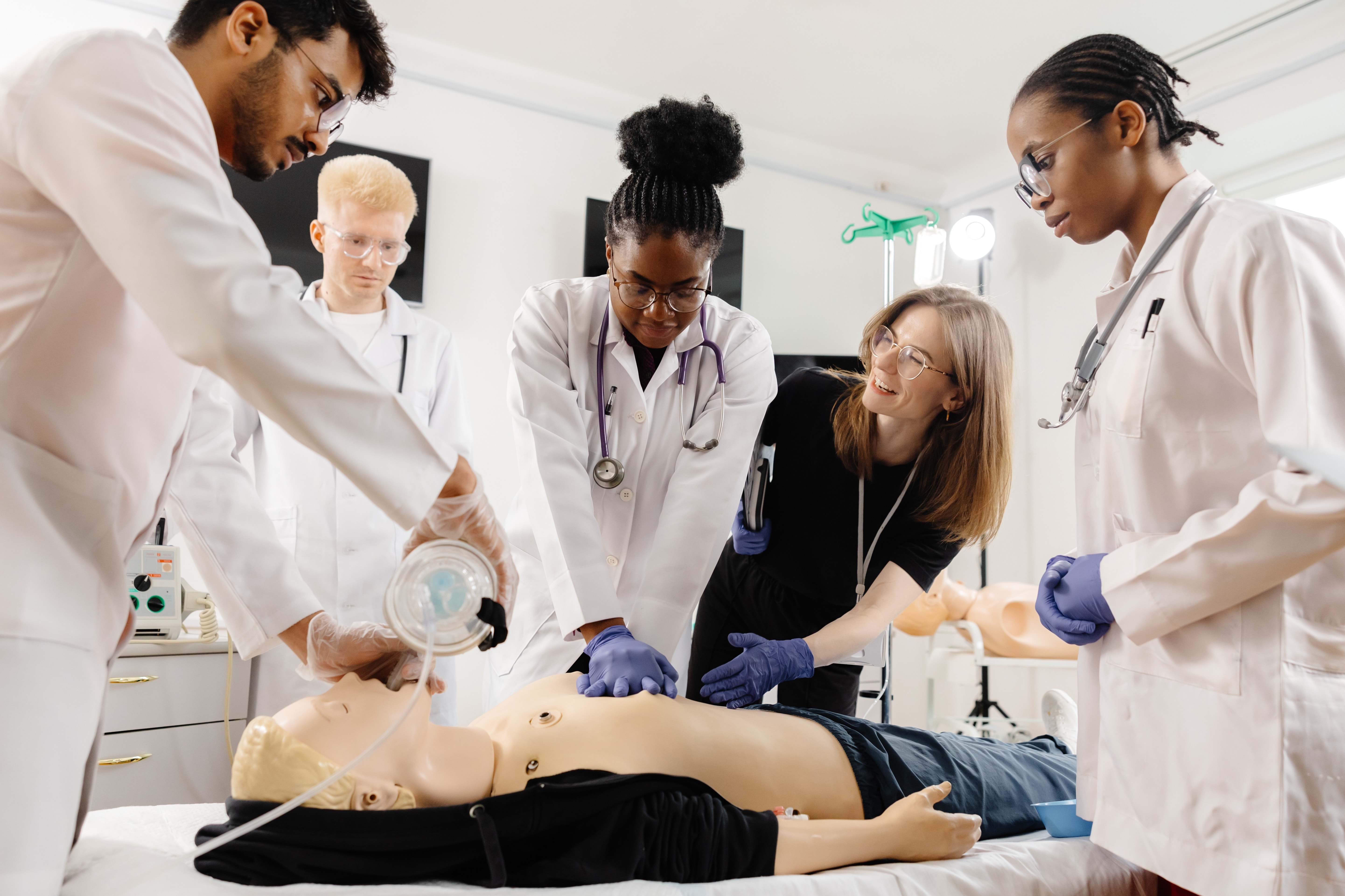 Medical students learning how to perform CPR first aid